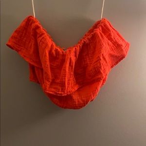 orange strapless top with tags still on it
